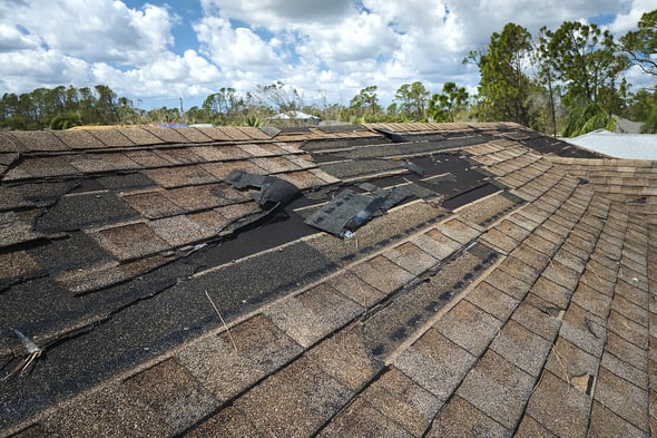 bigstock-Damaged-House-Roof-With-Missin-463219377