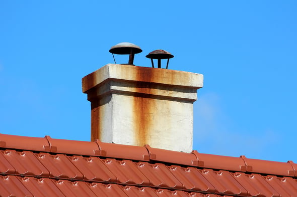 bigstock-Two-Flue-Metal-Pipes-Chimney-W-449973673